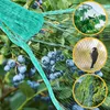 A close-up of a blueberry bush covered in a green protective net, with three circular insets showing birds interacting with nets. Anteprima dell’immagine prodotto