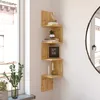 A wooden corner shelf unit with decorative items, placed next to a window. Voir les images du produit