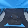 Close-up view of a blue and black fabric item, possibly a pet carrier or tent, showing pockets and mesh. Produktbild-Vorschau