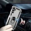 A hand holding a silver phone case with a ring holder, attached to a rose gold magnetic car mount on a car's air vent. Produktbild-Vorschau