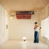 An upside-down room with a person standing in it. Anteprima dell’immagine prodotto
