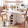 A white dining table with storage compartments, set in a dining room with chairs and a vase of flowers. Náhľad obrázku produktu