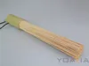 A bamboo wok brush on a plain gray background. Produktbild-Vorschau
