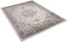 A rectangular rug with a traditional pattern is shown from a slightly elevated angle against a white background. Produktbild-Vorschau