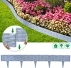 A garden border made of interlocking gray plastic pieces is shown installed along a flower bed with pink and white flowers and green grass. An inset shows how the pieces connect. A separate image below shows a single piece of the border with stakes. Produktbild-Vorschau