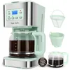 A mint green and silver coffee maker with a glass carafe filled with coffee, along with separate coffee filters and an empty carafe, displayed against a white background. Produktbild-Vorschau