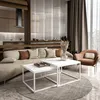A modern living room with a couch, coffee table, and armchair. Produktbild-Vorschau