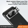A close-up of a black Google Pixel 8 Pro phone with a glass lens protector being applied to the camera module. Produktbild-Vorschau