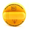 A yellow oil filler cap with text and symbols. Náhled obrázku produktu