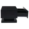 A black modern coffee table with one drawer pulled out, shown from a side angle. Anteprima dell’immagine prodotto