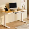 A modern standing desk setup with a computer, tablet, and accessories. Produktbild-Vorschau