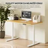 An adjustable standing desk with a computer and office accessories. Náhled obrázku produktu