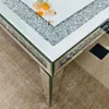 A close-up view of a mirrored coffee table with crushed diamond accents. Anteprima dell’immagine prodotto