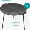 A black cast iron grill plate with removable legs is shown from a slightly elevated angle, with dimensions and feature callouts. Produktbild-Vorschau