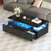 A modern black coffee table with LED lighting is placed in a living room setting next to a gray sofa. Produktbild-Vorschau