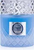A close-up studio shot of a blue perfume bottle with a silver label. Voir les images du produit