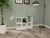 A white cube shelf unit with books and decorative items on it, placed in a room with a plant and a floor lamp. Produktbild-Vorschau