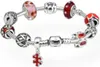 A bracelet with multiple charms displayed on a white background. Náhled obrázku produktu