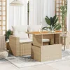 A patio set with a table and chairs on a patio with plants and curtains. Produktbild-Vorschau