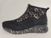 A side view of a black Rieker women's boot with a balloon pattern on the ankle shaft and sole. Produktbild-Vorschau