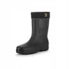 A black boot with a knitted cuff is shown against a white background. Produktbild-Vorschau