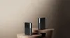 Two black and gray Xiaomi Mesh System routers are placed on wooden stands against a gradient brown background. Náhľad obrázku produktu