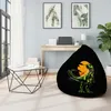 A bean bag chair with a dinosaur graphic is placed in a modern living room setting. Náhľad obrázku produktu