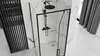 A modern bathroom with a black-framed shower enclosure, marble-patterned walls, and grey curtains. Podgląd zdjęcia produktu