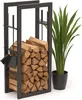 A metal firewood rack filled with logs, next to a potted plant. Náhľad obrázku produktu