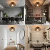 Collage of four different interior design scenes featuring a black industrial-style ceiling light. Anteprima dell’immagine prodotto