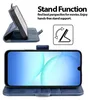 A blue flip case for a smartphone is shown in two configurations: one open and propped up as a stand, and another showing the phone inside the case. Anteprima dell’immagine prodotto