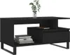 A black coffee table with a vase of greenery on top and books on the shelf. Produktbild-Vorschau