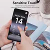 A hand is holding a smartphone displaying product information, with a magazine and a speaker in the background. Produktbild-Vorschau