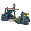 A diorama of a coral reef with two Avatar action figures standing on a platform. Náhled obrázku produktu