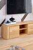 A wooden TV stand with a television mounted above it, in a modern living room setting. Produktbild-Vorschau