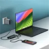A laptop, smartphone, and power adapter are charging on a desk. Produktbild-Vorschau