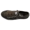 A top-down view of a single green sneaker. Voir les images du produit