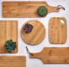 A collection of bamboo cutting boards with succulents. Anteprima dell’immagine prodotto