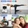 A collage of images showing a digital camera being used for various purposes: as a webcam for fitness streaming, live-streaming a guitar performance, and taking selfies with a timer. Social media icons are displayed at the top. Produktbild-Vorschau