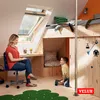 A woman sits at a desk in a child's room, while a young boy stands nearby with a skateboard. Voir les images du produit