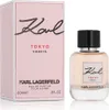 A perfume bottle and its packaging are displayed against a white background. Voir les images du produit