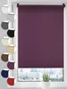 A purple roller blind is shown in a window, with a cityscape visible outside. Several swatches of different colored roller blinds are displayed to the left of the main product. Produktbild-Vorschau