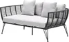 A studio shot of a modern outdoor daybed with a black metal frame and woven rope sides, featuring light gray cushions. Produktbild-Vorschau
