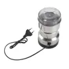 A stainless steel electric grinder with a transparent lid and a black power cord with a plug, shown on a white background. Náhled obrázku produktu