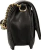 Side view of a black handbag with gold chain detail. Produktbild-Vorschau
