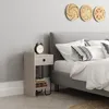 A modern bedroom scene with a nightstand next to a bed. Produktbild-Vorschau
