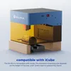 A SCULPFUN RA Mini laser engraver is shown on a wooden base, with a cylindrical object being engraved inside the yellow protective enclosure. Text at the bottom indicates compatibility with iCube. Produktbild-Vorschau