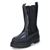 A studio shot of a black boot against a white background. Voir les images du produit