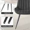 Close-up views of a black chair's legs and seat, with text overlays highlighting features. Voir les images du produit