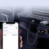 A Bluetooth audio adapter is shown plugged into a car's dashboard, with a smartphone displaying its Bluetooth connection settings. Podgląd zdjęcia produktu